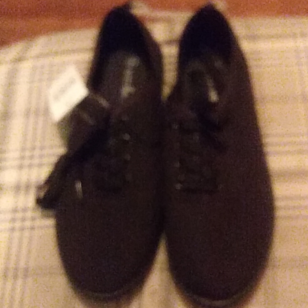 New pair of black shoes, size 8